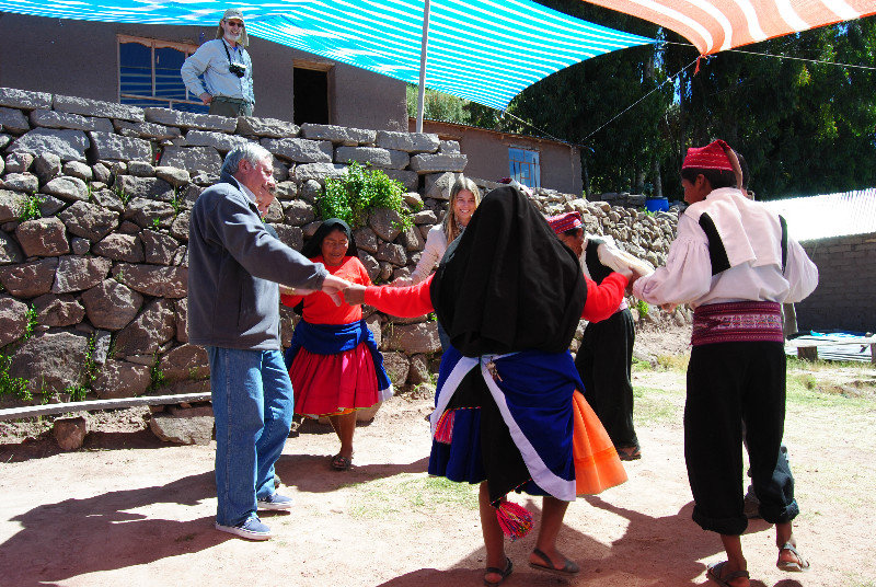 Tourists participating in a folk dance on Taquile Island