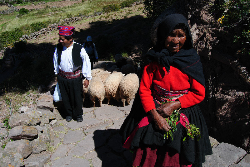 Shepherds blocking the path on Taquile Island (two soles please)