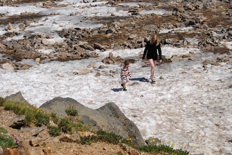Rocky Mountain NP: Liam and Rosanna walking across a snow field