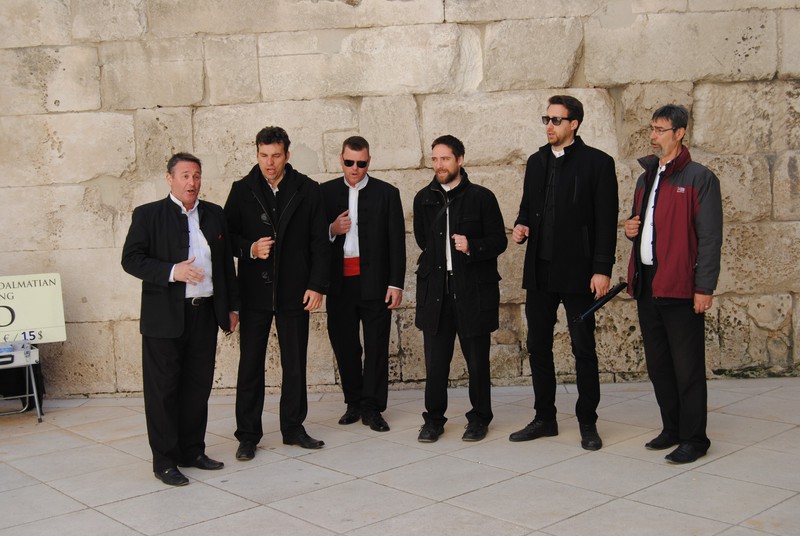 Klapa group of men harmonizing a capella in the Golden Gate courtyard