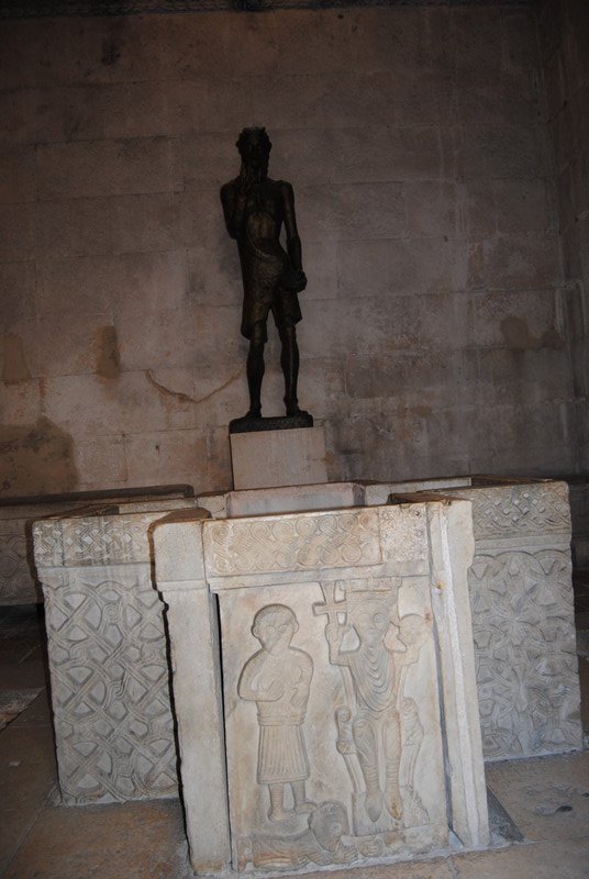 A modern statue of John the Baptist in Jupiter's Temple, now the Baptistry