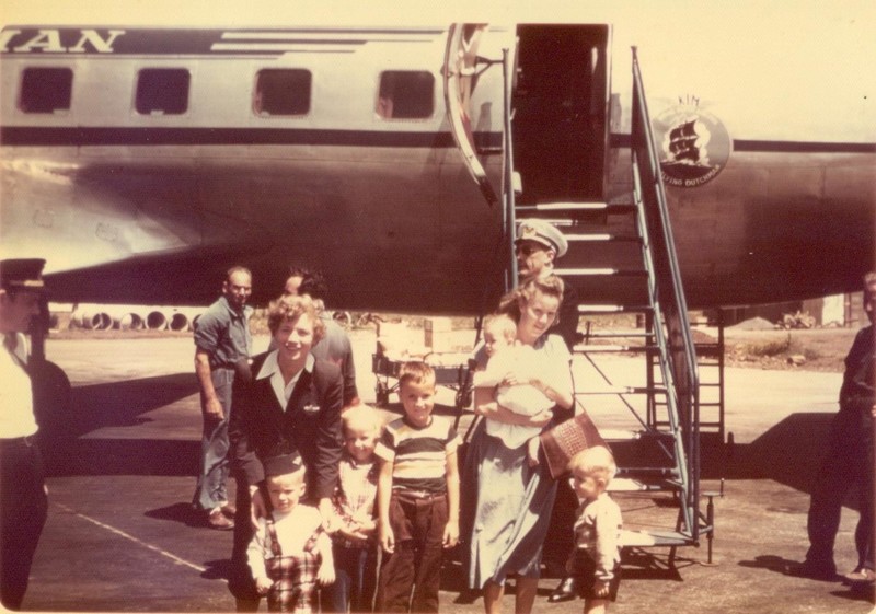 Mom and us kids flying from Thailand to Europe