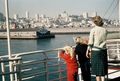 Mom with Bob, Sue, and Judy waving goodbye to Oakland from the SS Steel Rover deck as we sail across the Pacific