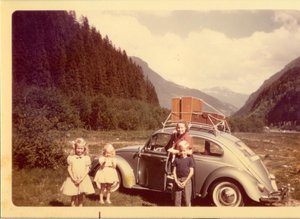 Mom with Bob, Sue and Judy and our VW bug driving across the States