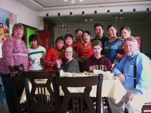 Carol, Mom, WIll, and Bob with the wait staff at a restaurant in Minxian, China