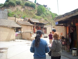 Mom looking for the mission compound in Minxian where she first lived with Dad after getting married
