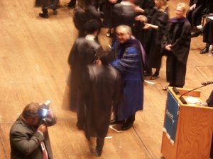 Will shaking the hand of the Yeshiva University President at graduation ceremony
