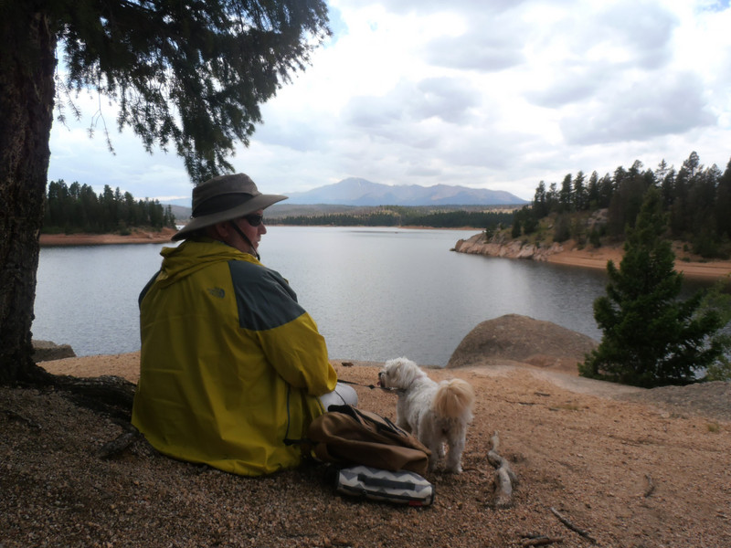 Bob and dog Bonnie taking a break on a walk around Rampart Range Lake
