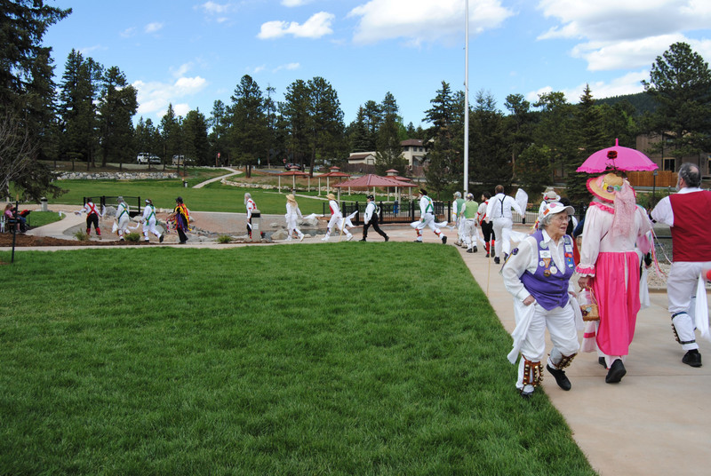 A conga line of Morris Dancers in Memorial Park