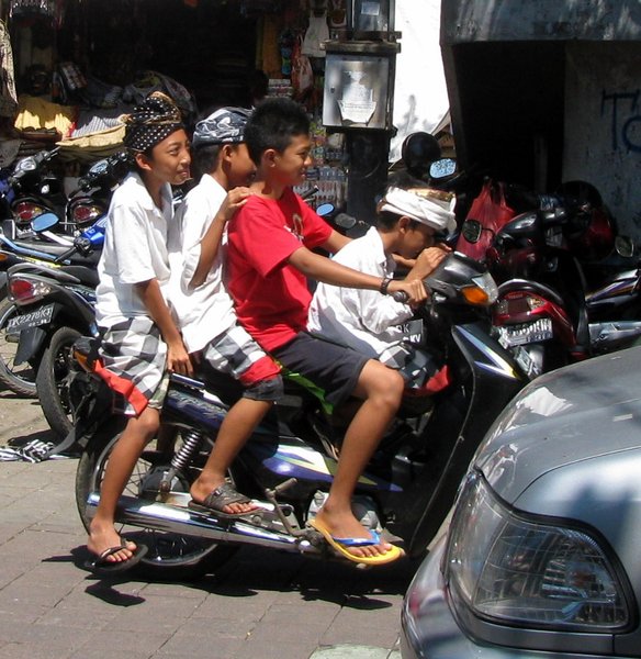Four boys on a bike