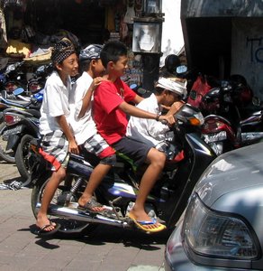 Four boys on a bike