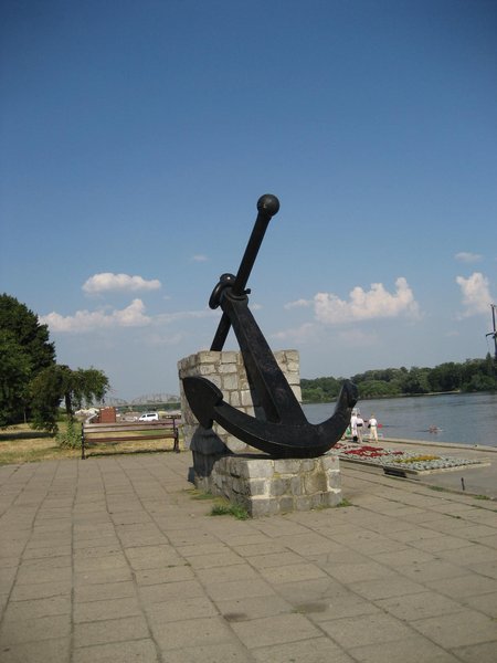 Anchor statue near river
