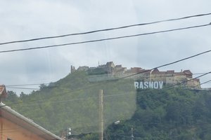 Rasnov sign on hill, from bus