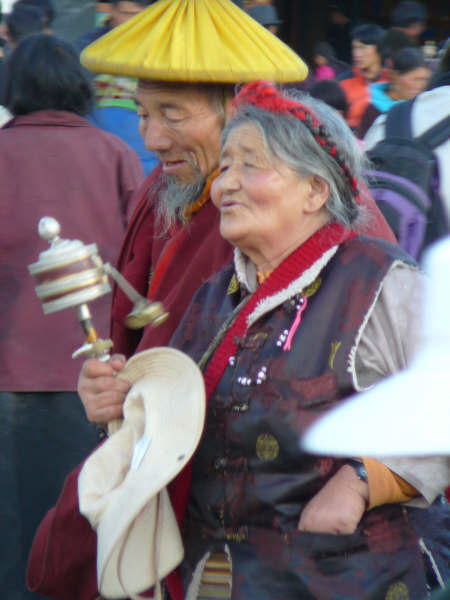 Tibetan with portable prayer wheel