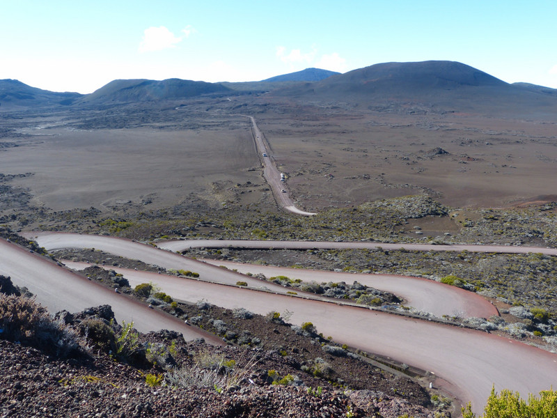 Winding road down towards the unpaved volcano road