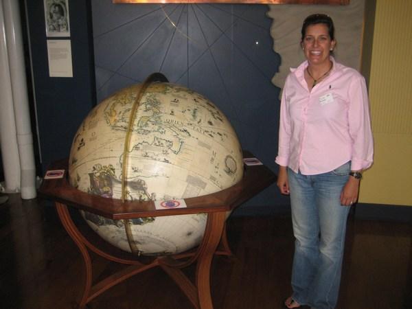 Katie checks out the globe for her next travel stop!