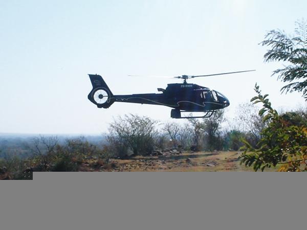 Helicoptor arrives for the flight over Vic Falls