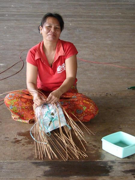 Woman basket weaving at Kayan Longhouse near Belaga