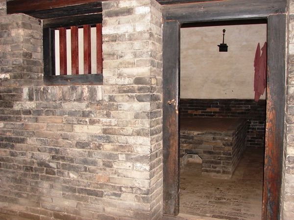 Prison cell in ancient Government Building, Pingyao