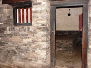 Prison cell in ancient Government Building, Pingyao | Photo