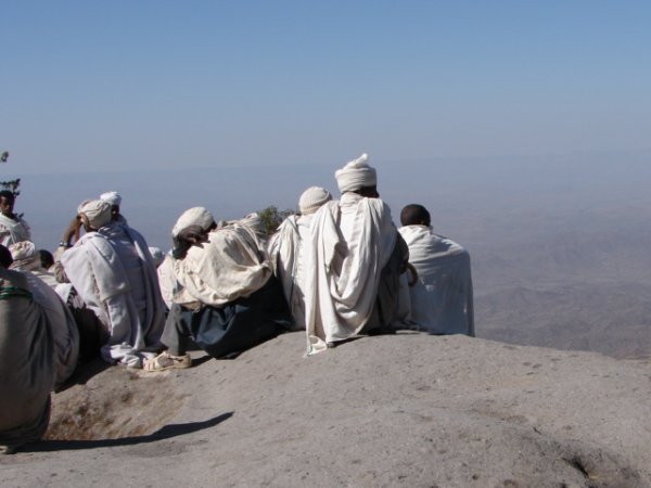 Monks contemplating the view from the Church of Ashten Marian - at the top of a mountain near Lalibela