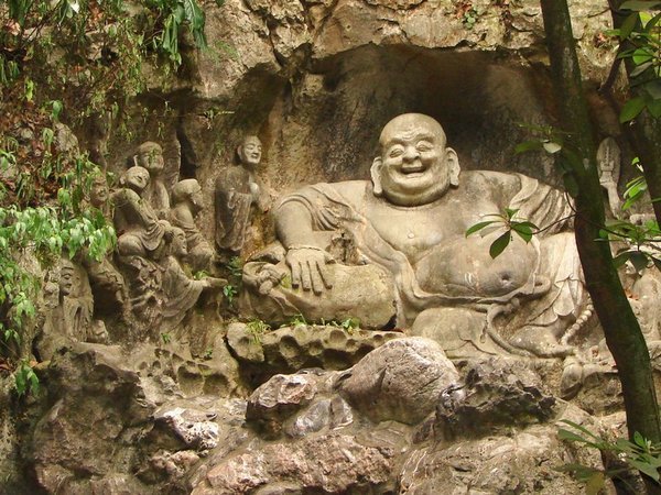 Buddhas carved into the hillside in the park near Linyin Temple.