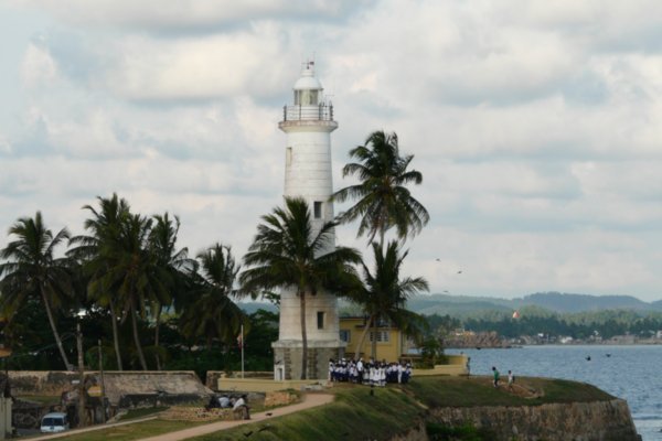 Lighthouse and school kids