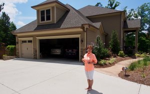 May Markoff in front of her house