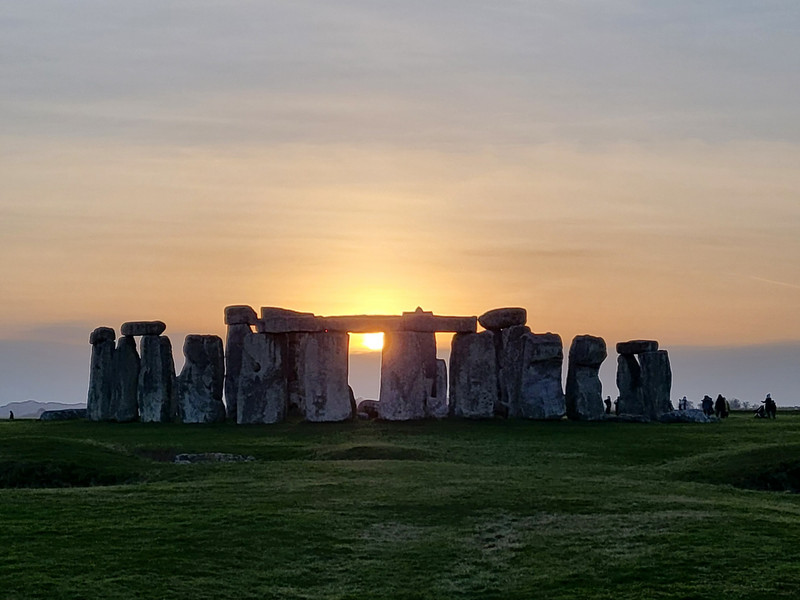 Another photo of the sun setting between the stones
