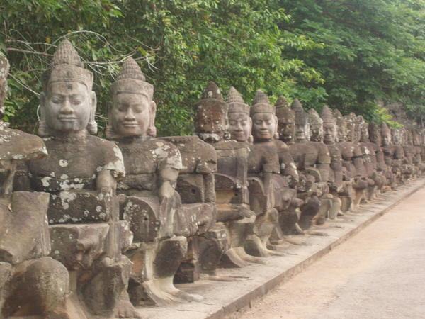 Guards on the entrance to Angkor Thom