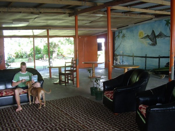 Matt chilling out at Drift in Fiji Hostel with 'Lucky' the dog