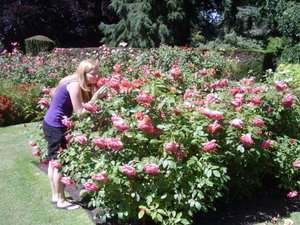 Dianna smelling the roses in the Botanic Gardens