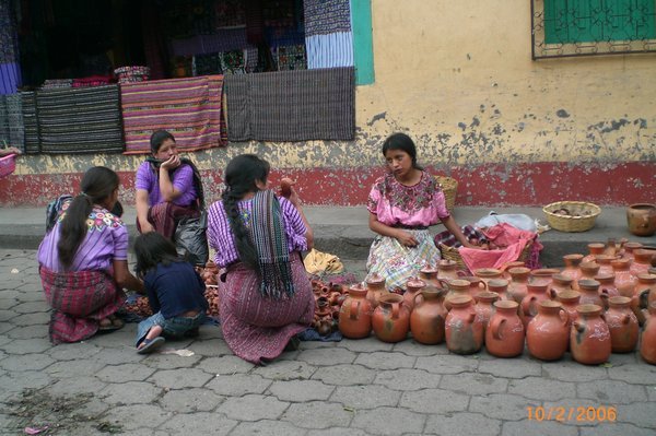 Mayan women selling pots