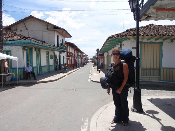 Jen carries her gear through the main street of Salento