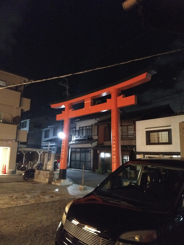 Neighborhood shrine at night