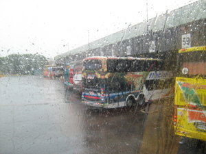 Bus station in the rain