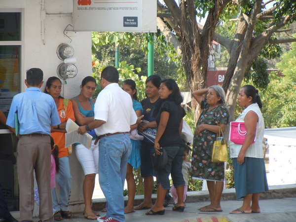 Women waiting in line for some kind of voucher