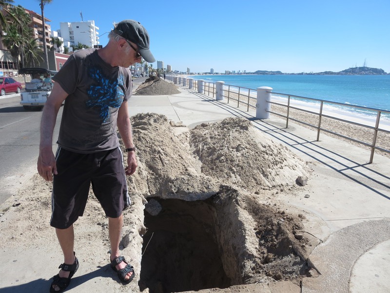One of many deep pits on malecon with no warning signs or barricades