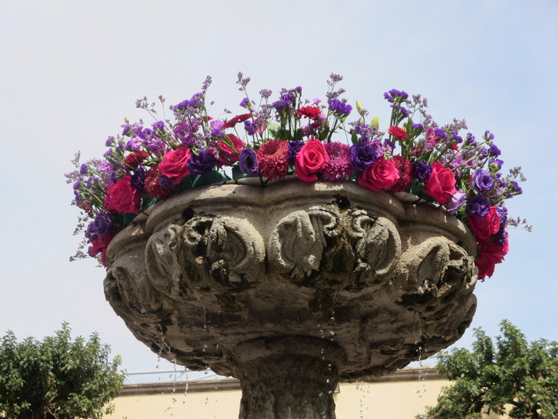 A flower crown on a fountain