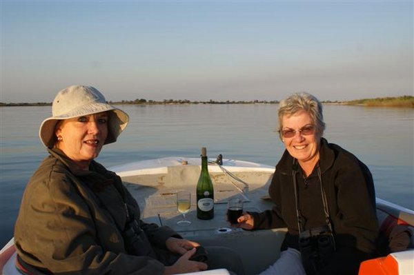 Two bird watchers concentrating momentarily on sundowners