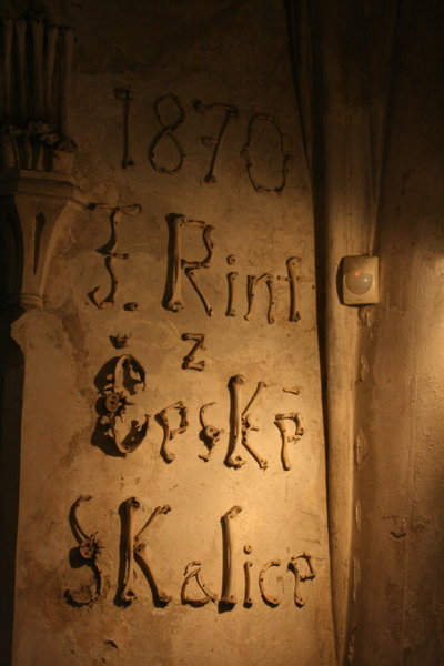 signature of the artist who created the bone art
