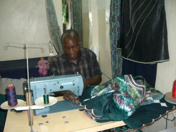Joelle at his sewing machine