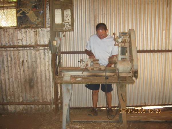 48  7-7-09 Den having a fiddle at an old lathe at Lutheran Mission at Hermannsburg