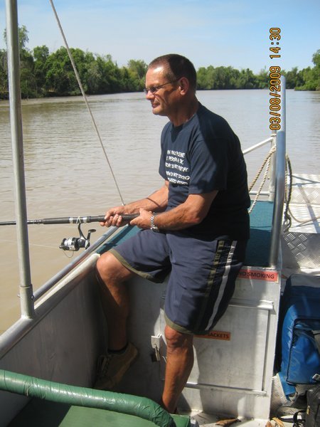 37   3-8-09    Den fishing on the Adelaide River on the Croc Tour