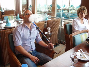 Rami smoking a Shishe (pipe) in Seven Sea Resturant