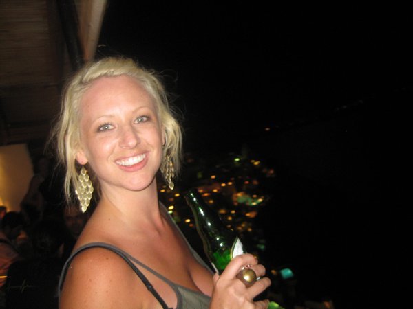 Lovely Jess and the Thira cliffside at night
