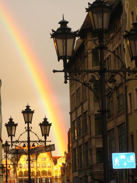 Picturesque medieval buildings with a perfect rainbow setting it off