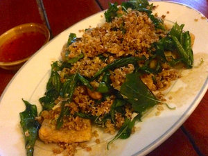 Fried fish topped with crispy thai basil leaves and minced pork