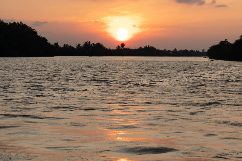 The sun setting on the Mekong River