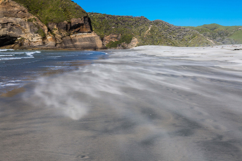 Sand whipping over the Wharariki Beach